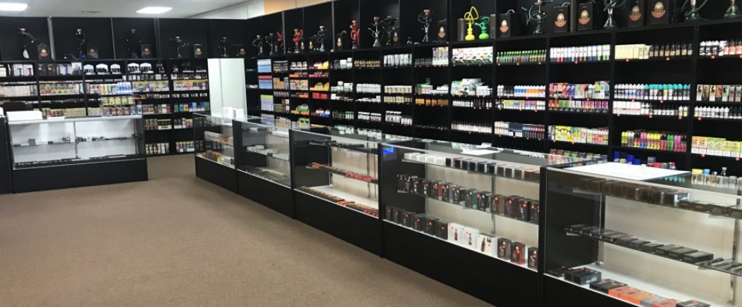 A well-lit, modern vape store display in Adelaide showcasing a variety of devices.